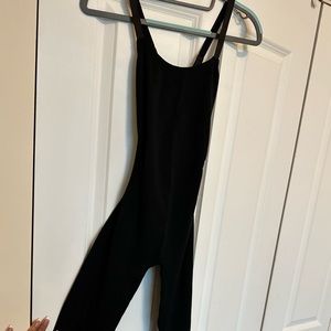 All spandex one piece. One size fits all. Cross straps in the back.